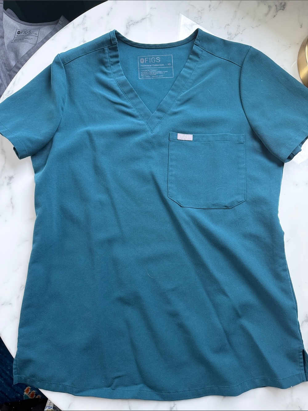 Figs Teal V-Neck Woman’s Scrub Top with Chest Pocket